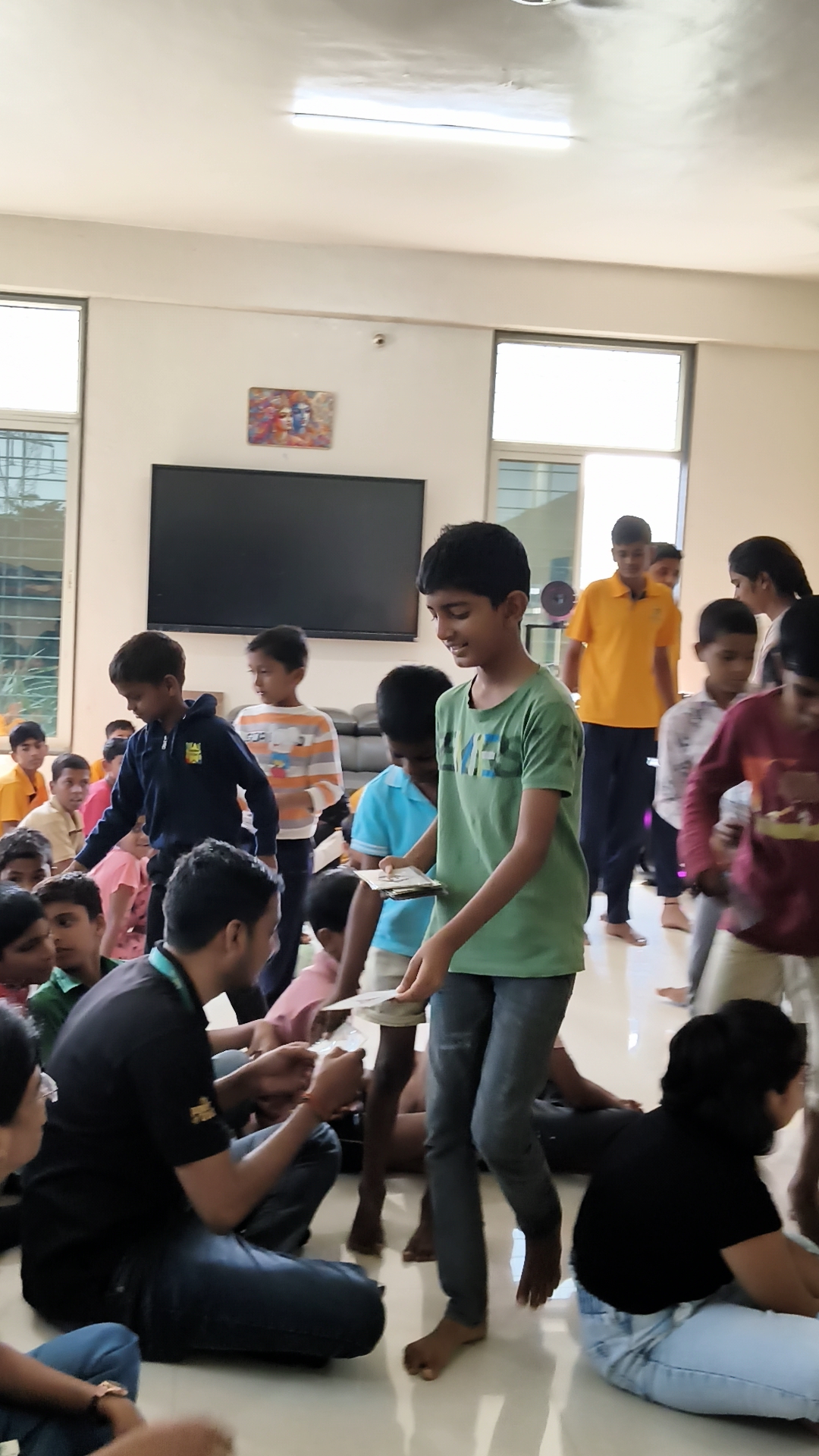 SAS Powertech team members with children at institution
